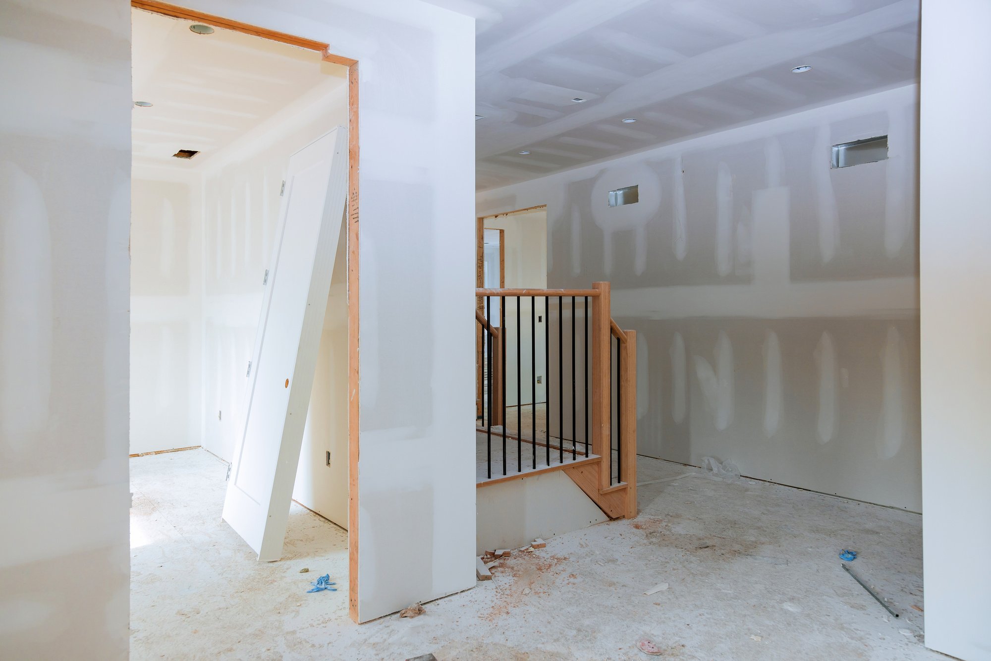 Finishing Putty in the Room Walls Plasterboards with Room under Construction